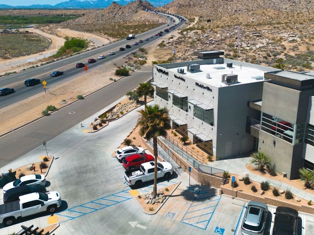 Aerial view of the Wika Road office building and parking for Optimum Audiology in Apple Valley, CA