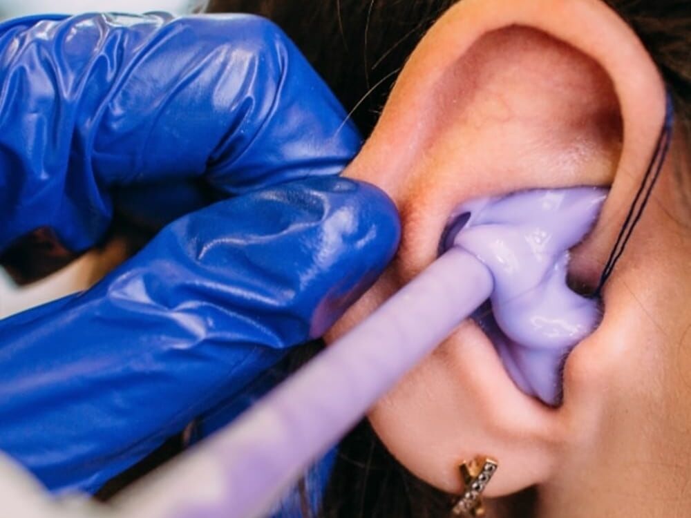 Custom ear impression being taken for hearing protection at Optimum Audiology in Apple Valley, CA