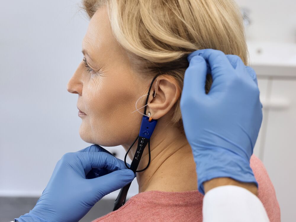 Probe microphone in place during Real Ear Measurement of a hearing aid at Optimum Audiology in Apple Valley, CA