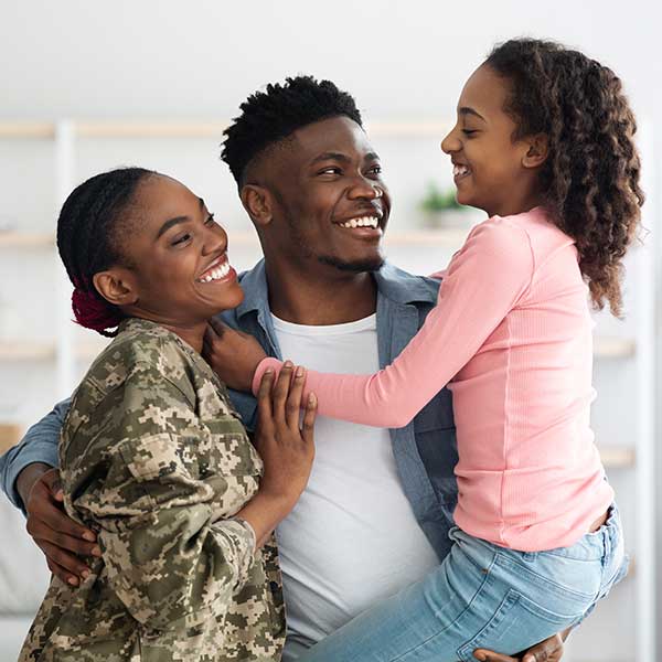 Family celebrating mom, a soldier, coming home. 